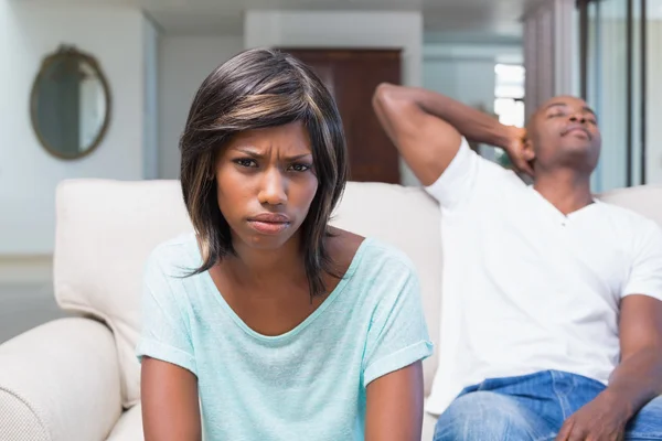Unhappy couple not talking after argument on sofa — Stock Photo, Image