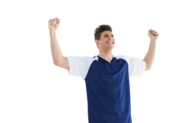 Jugador de fútbol en azul celebrando — Foto de Stock