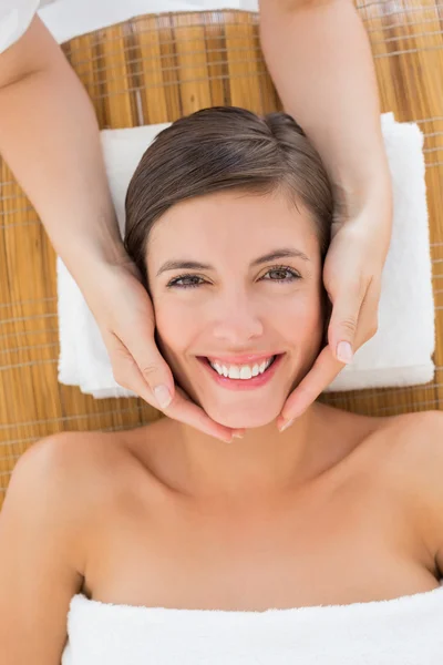 Attractive young woman receiving facial massage at spa center — Stock Photo, Image