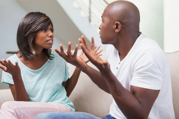 Angry couple having a dispute on sofa — Stock Photo, Image