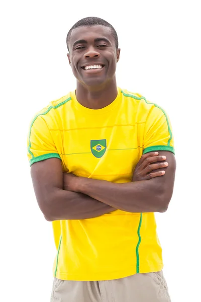 Happy brazilian football fan smiling at camera Royalty Free Stock Photos
