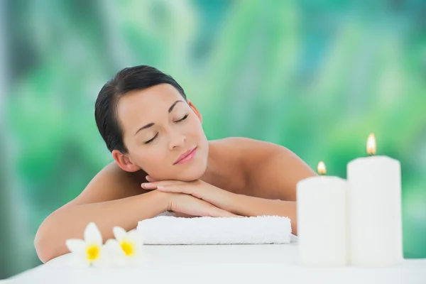 Brunette relaxing on massage table Stock Picture