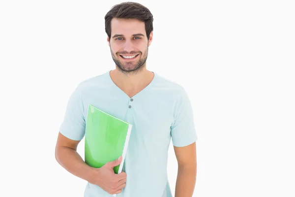 Handsome student smiling at camera — Stock Photo, Image