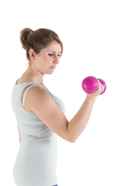 Mujer joven haciendo ejercicio con mancuerna — Foto de Stock