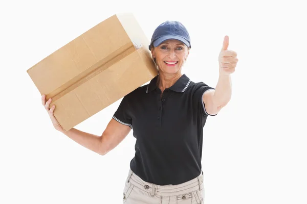 Happy delivery woman holding cardboard box — Stock Photo, Image