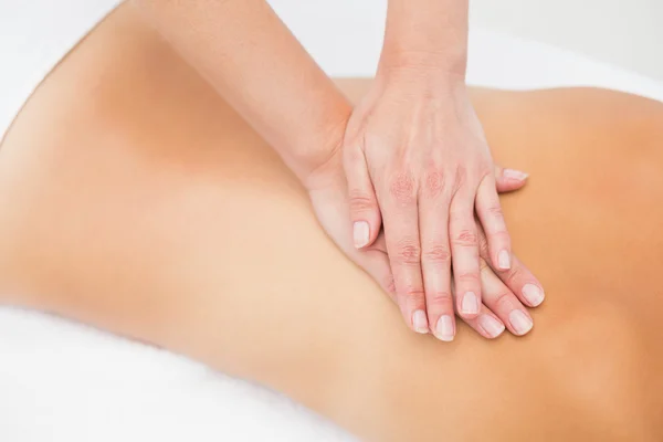 Woman receiving back massage at spa center — Stock Photo, Image