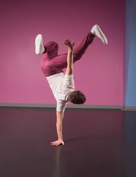 Cool break dancer doing handstand on one hand — Stock Photo, Image