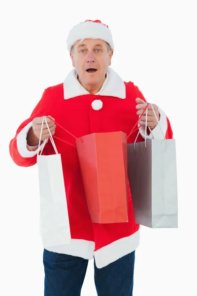 Homem festivo segurando sacos de compras — Fotografia de Stock