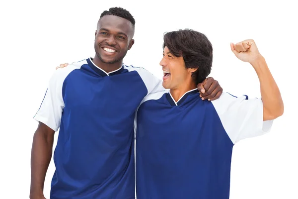 Jogadores de futebol em azul celebrando — Fotografia de Stock