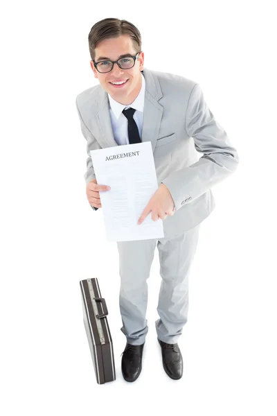 Geeky businessman showing contract to camera — Stock Photo, Image