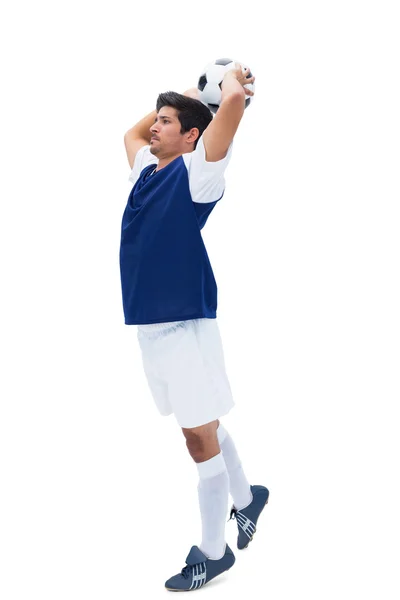 Jogador de futebol em branco jogando bola — Fotografia de Stock