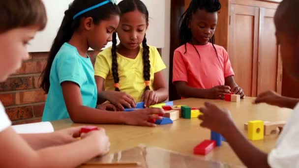 Pupils playing with building blocks — Stock Video