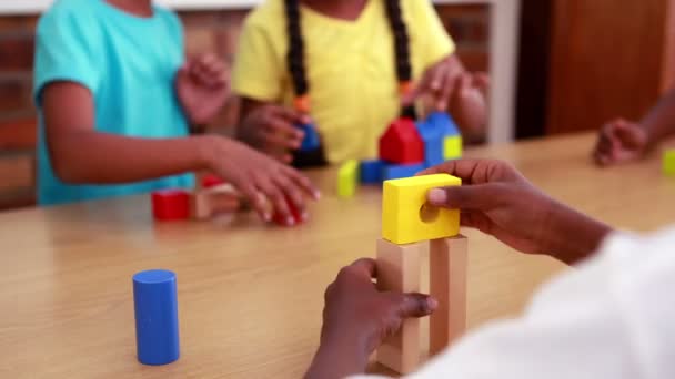 Pupils playing with building blocks — Stock Video