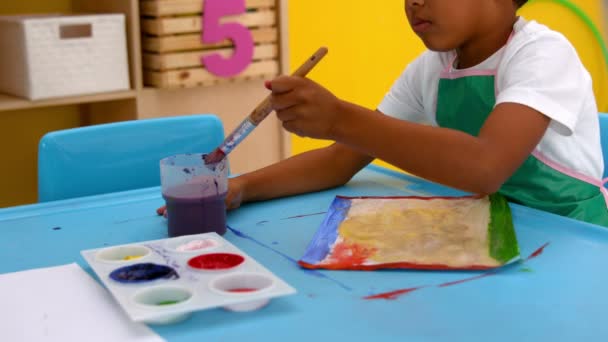 Boys painting at table in classroom — Stock Video