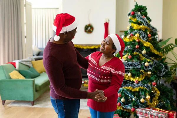 Happy African American Senior Couple Santa Hats Dancing Home Christmas — Stock Photo, Image