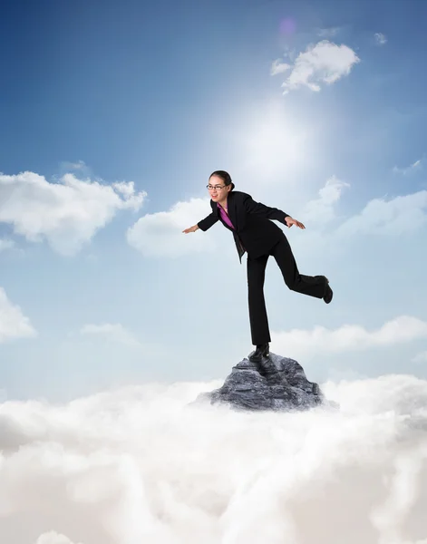 Businesswoman stepping and balancing — Stock Photo, Image