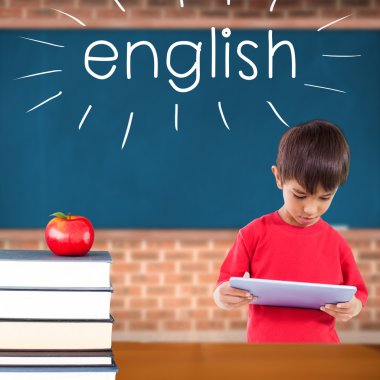 English against red apple on pile of books in classroom clipart