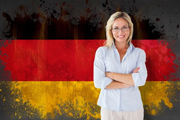 Estudiante sonriendo contra bandera de Alemania — Foto de Stock