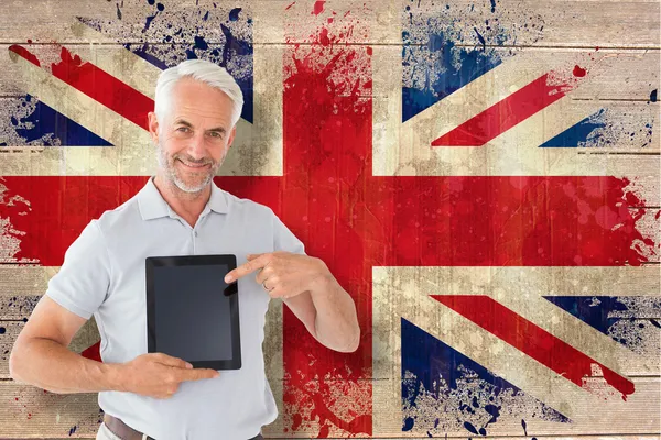 Student showing tablet against union jack flag — Stock Photo, Image