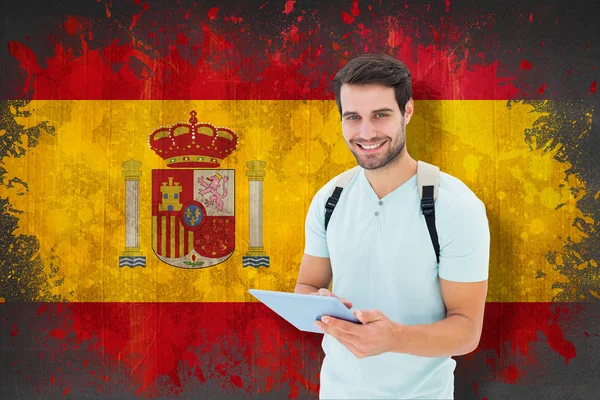 Estudiante usando tableta contra bandera de España — Foto de Stock