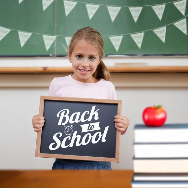 Cute pupil showing chalkboard — Stock Photo, Image