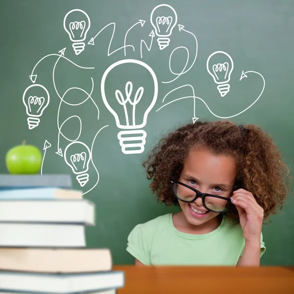 Composite image of cute pupil tilting glasses — Stock Photo, Image