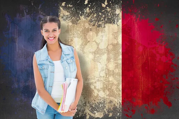 Estudiante sujetando bloc de notas contra bandera de Francia — Foto de Stock