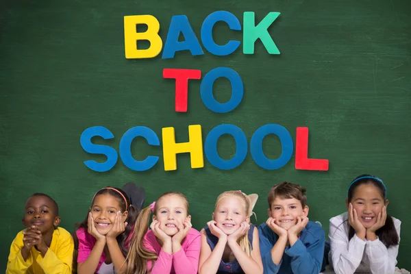 Pupils with back to school message — Stock Photo, Image