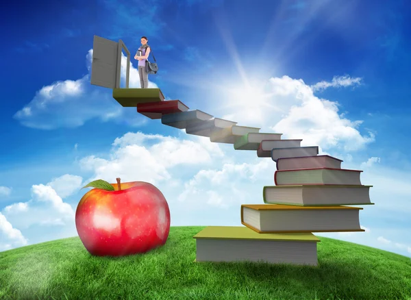 Student holding books and bag — Stock Photo, Image