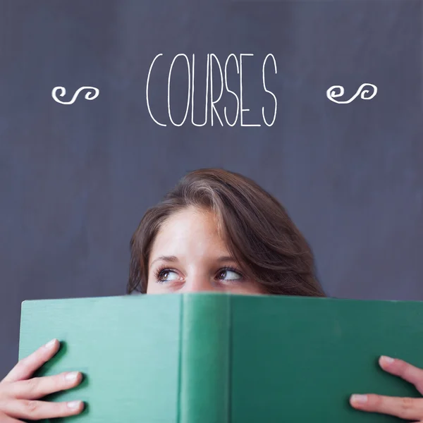 Courses against student holding book — Stock Photo, Image