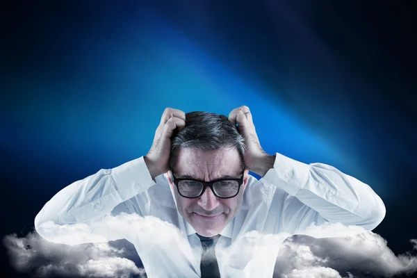 Businessman touching his head — Stock Photo, Image