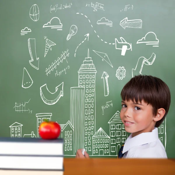 Cute pupil holding chalk — Stock Photo, Image