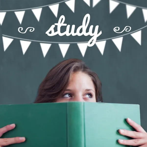 Study against student holding book — Stock Photo, Image