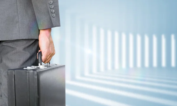 Composite image of businessman holding briefcase — Stock Photo, Image