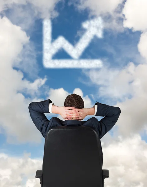 Businessman sitting in swivel chair — Stock Photo, Image