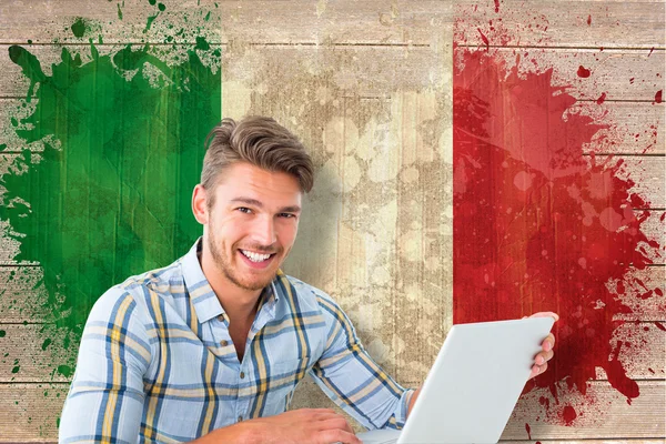 Student using laptop against italy flag — Stock Photo, Image