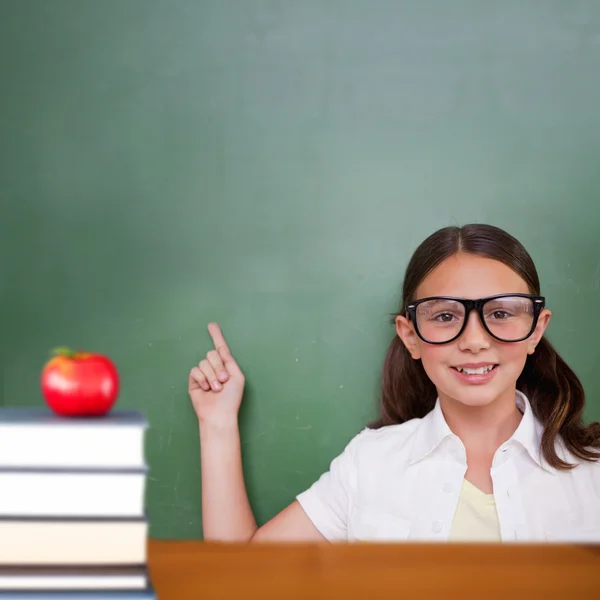 Composite image of cute pupil pointing — Stock Photo, Image