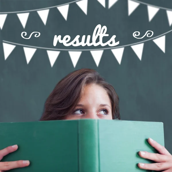 Results against student holding book — Stock Photo, Image