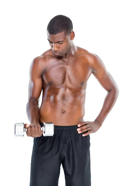 Fit young man lifting dumbbell — Stock Photo, Image