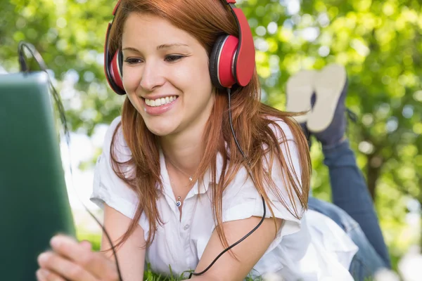 Redhead using her tablet pc — Stock Photo, Image