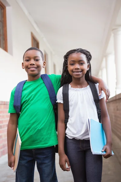 Cute pupils in corridor — Stock Photo, Image