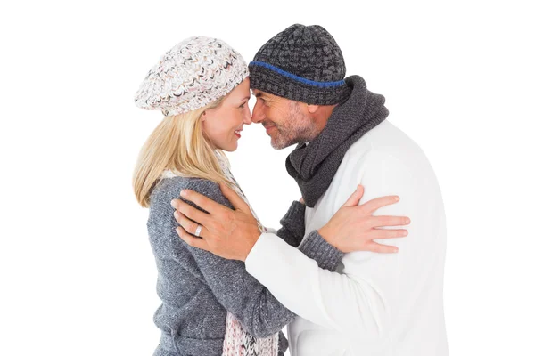 Happy couple in winter fashion embracing — Stock Photo, Image