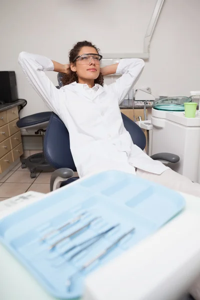 Dentist sitting back and relaxing — Stock Photo, Image