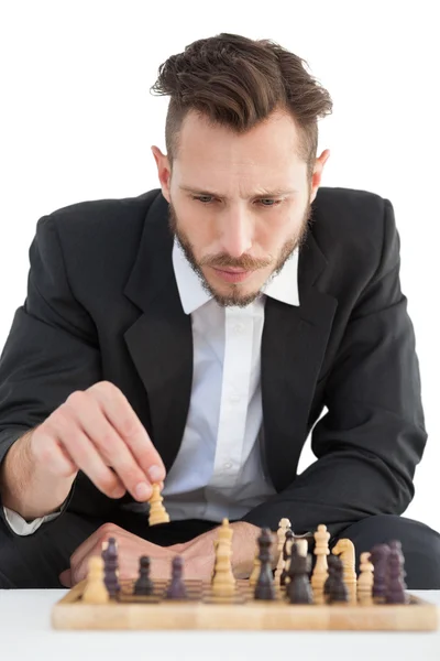 Focused businessman playing chess solo — Stock Photo, Image