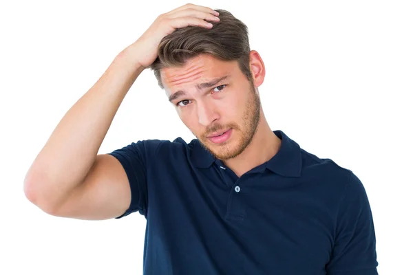 Handsome young man looking confused — Stock Photo, Image