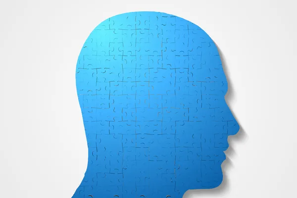 Blue head made of jigsaw pieces — Stock Photo, Image