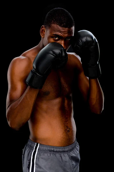 Shirtless muscular boxer in defensive stance — Stock Photo, Image