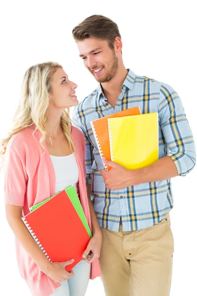Casal estudante atraente sorrindo um para o outro — Fotografia de Stock
