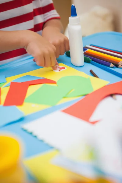 Little boy making art in classroom — Stock Photo, Image