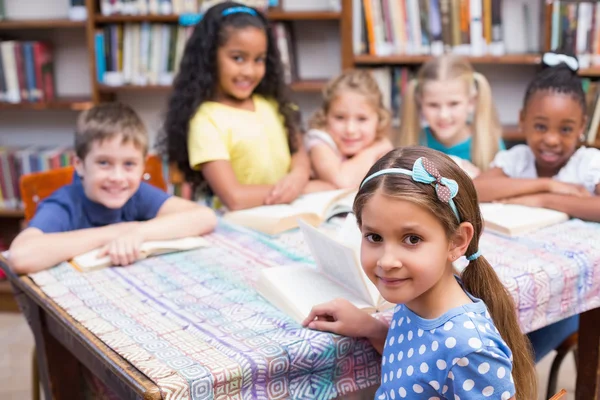 Cute pupils in library — Stock Photo, Image